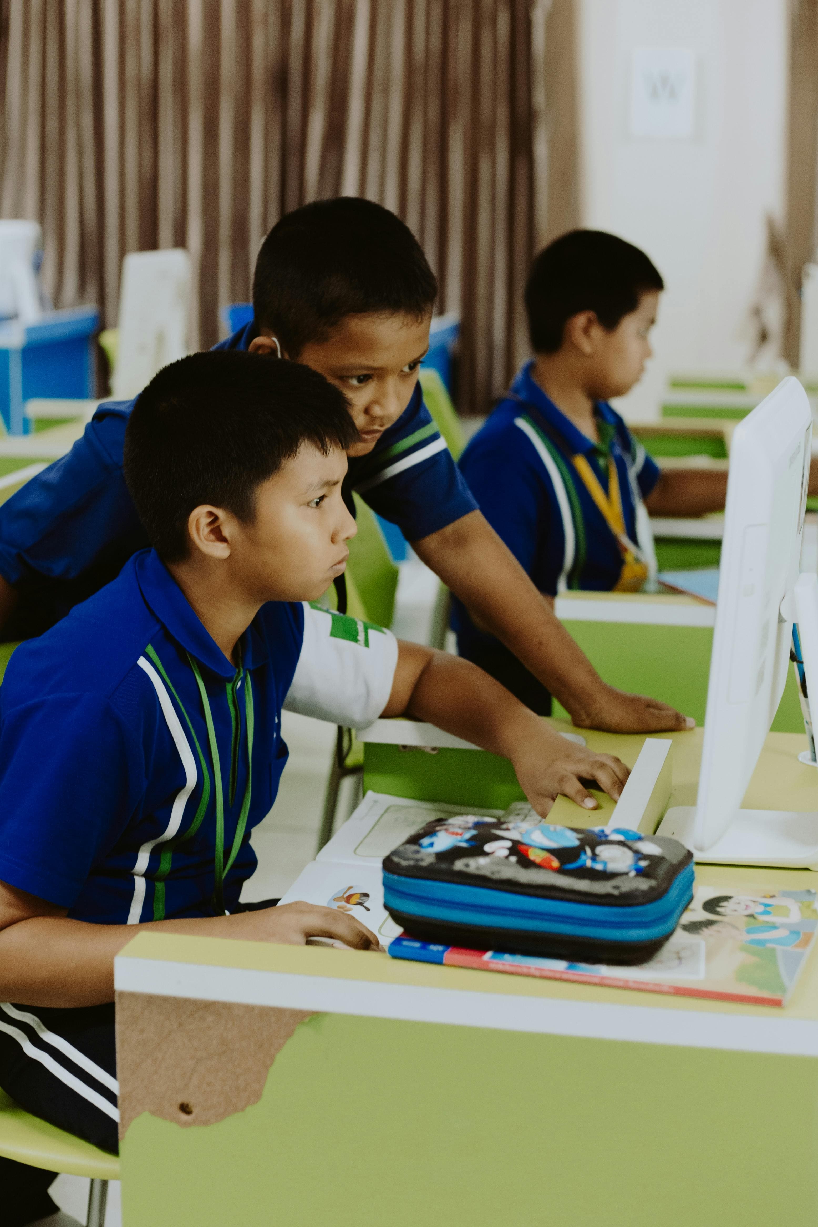 Teacher and student collaborating in class